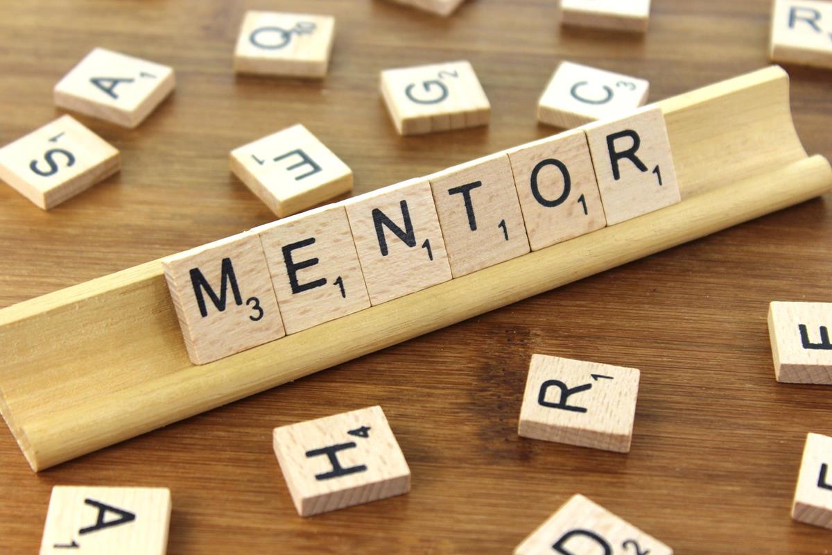 The word mentor spelled with letter titles